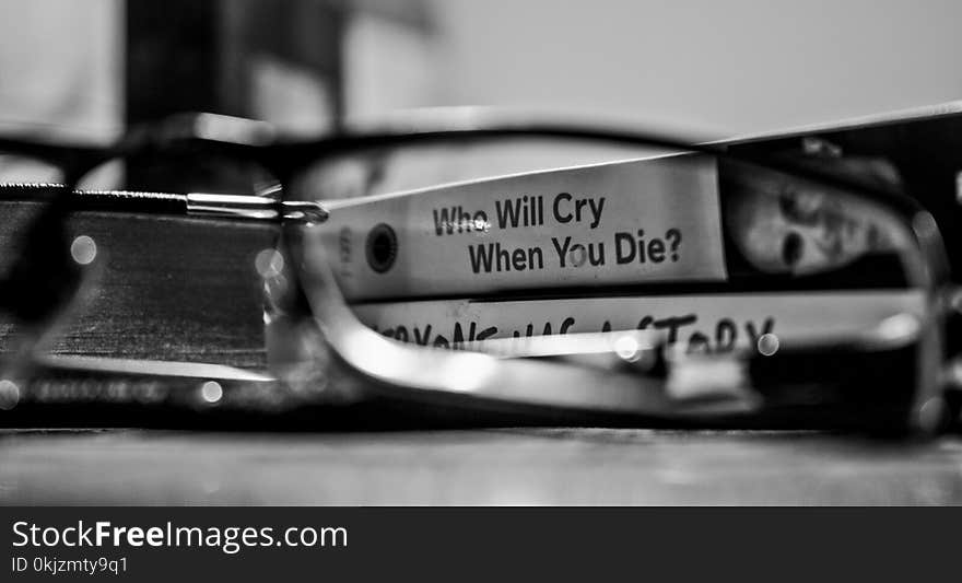 Grayscale Photography View Through Eyeglasses Who Will Cry When You Die? Labeled Book