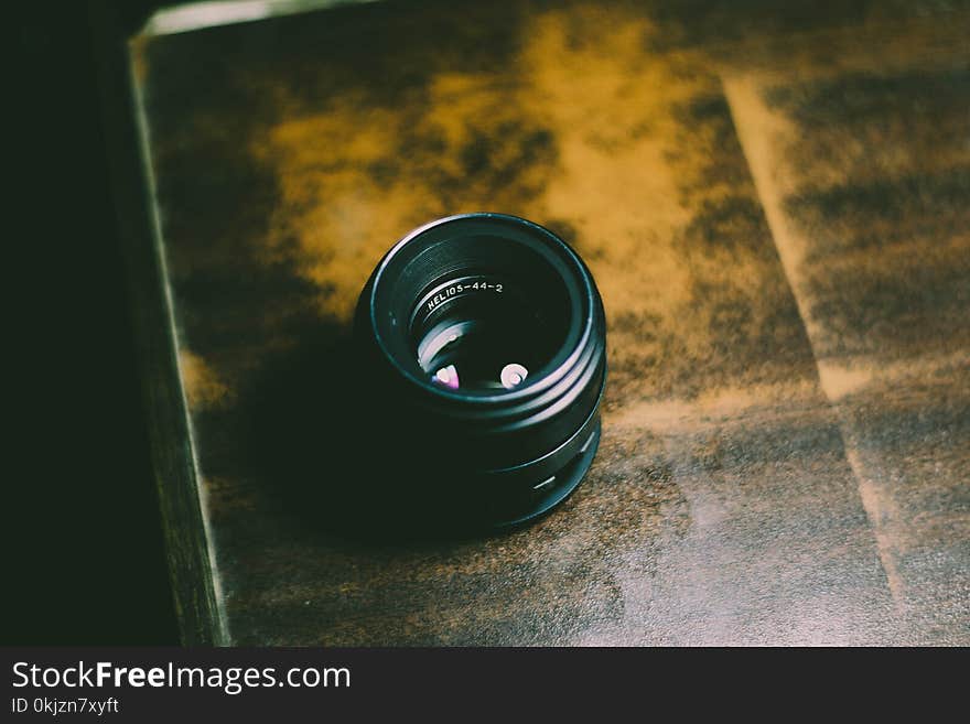 Person Taking Photo of Camera Lens