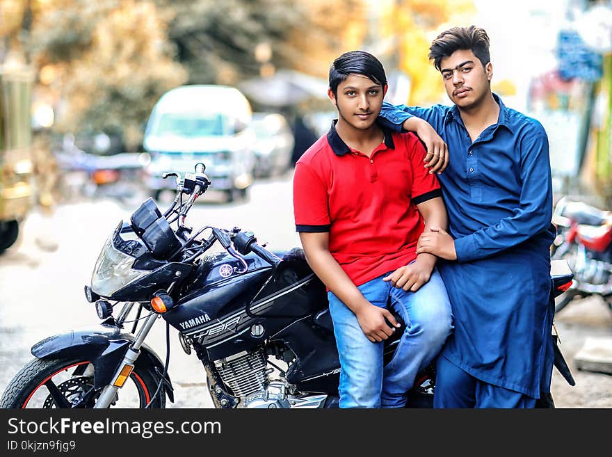 Two Men and Red and Blue Shirts