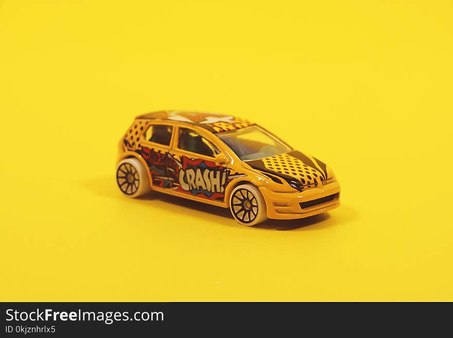 Yellow and Red 5-door Hatchback Die-cast Model