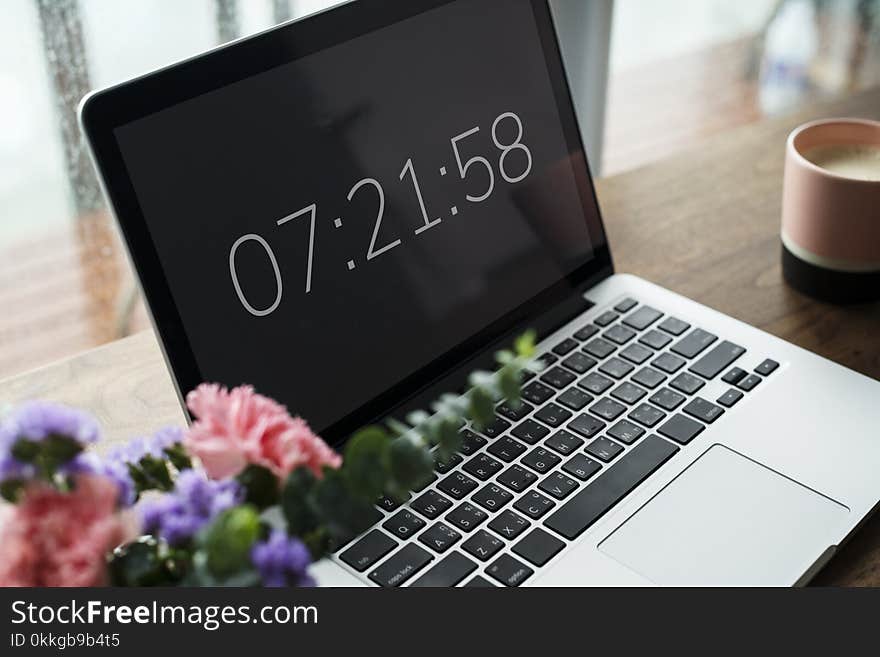 Close-Up Photography of MacBook near Flowers