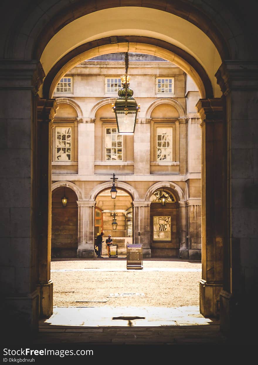 Gray Pendant Lamp Hanging on Arch Pathway