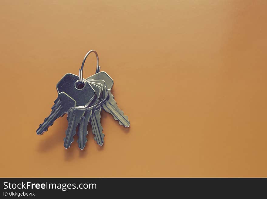 Photography of Keys on Orange Surface