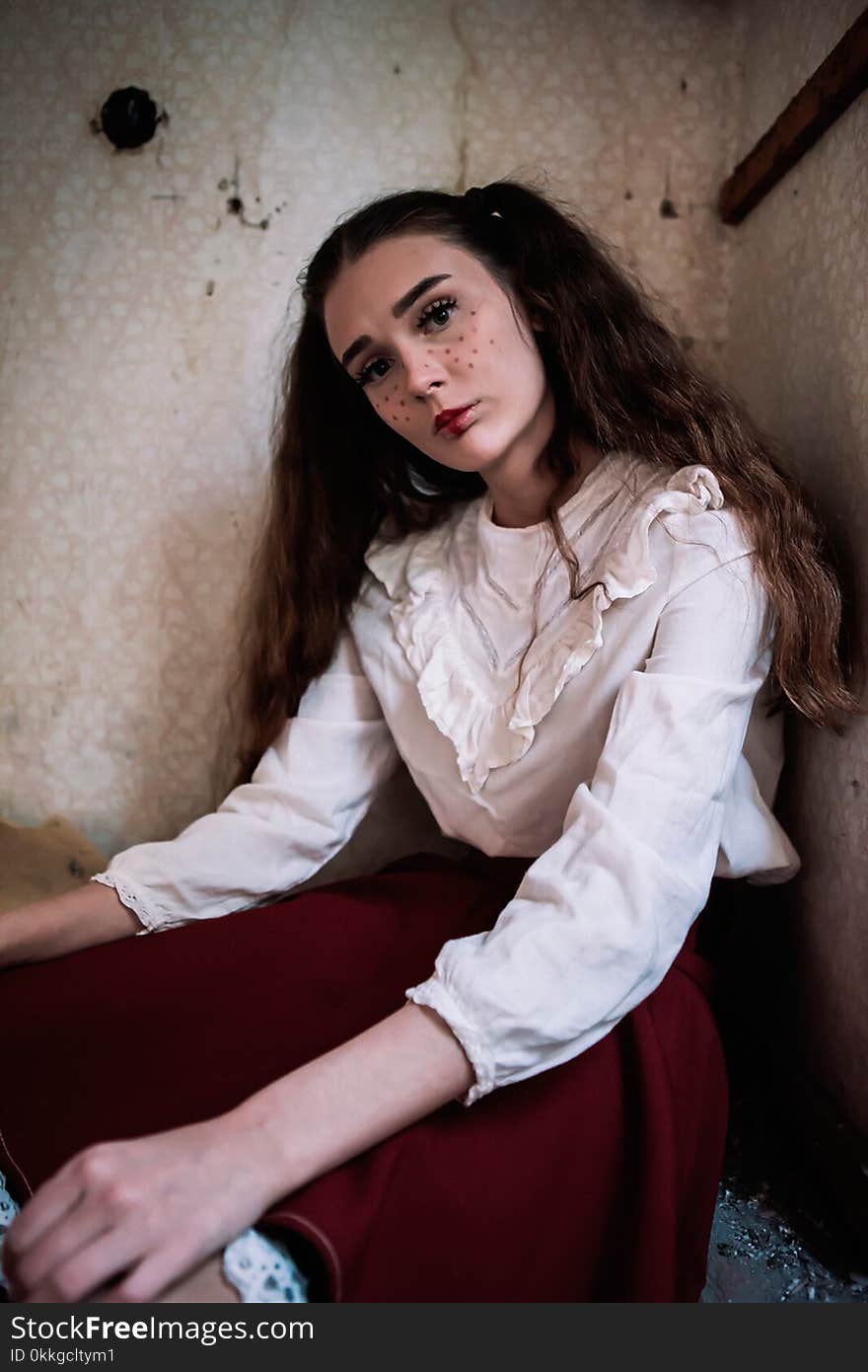 Brown Haired Woman Wearing White Long-sleeved Shirt and Red Skirt