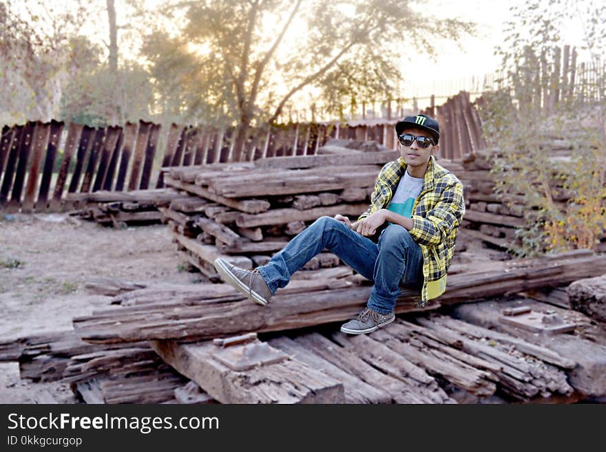 Man in Blue Jeans Posing for Photo