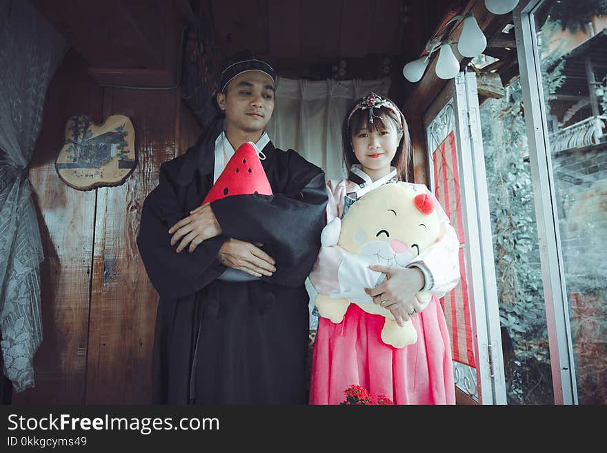 Man and Woman Wearing Traditional Dresses