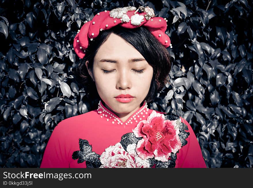 Woman With Her Eyes Closed Wearing Pink Floral Top