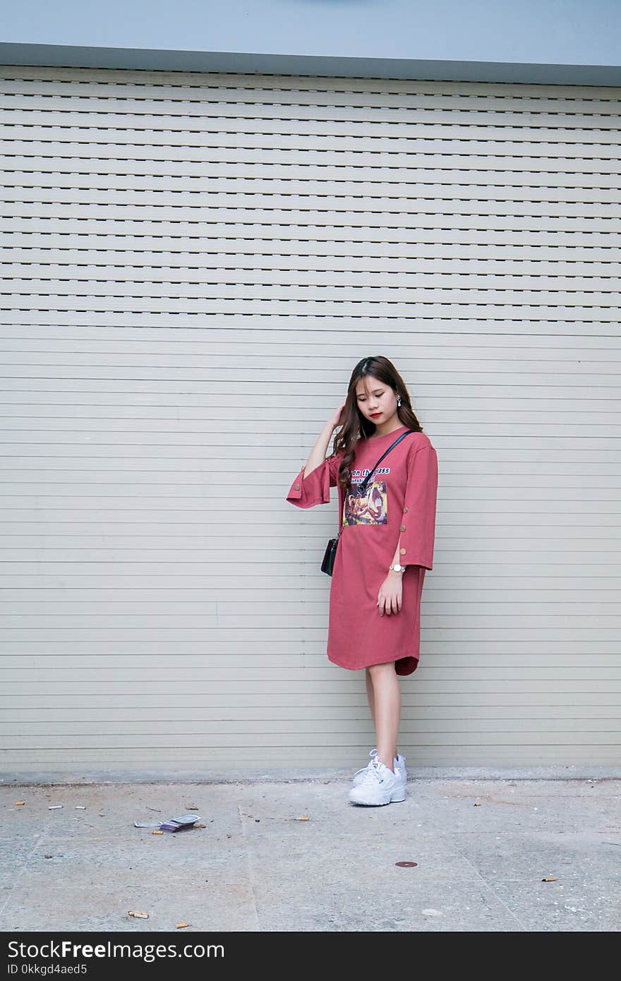 Woman in Pink Long-sleeved Midi-dress and Pair of White Shoes