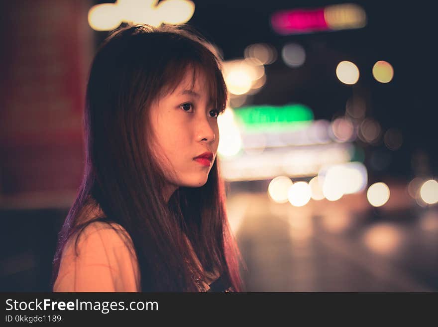 Woman Wearing Beige Tops and Bokeh Light