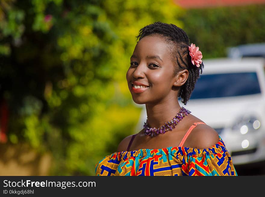 Woman Wears Multicolored Tube Dress Smiling