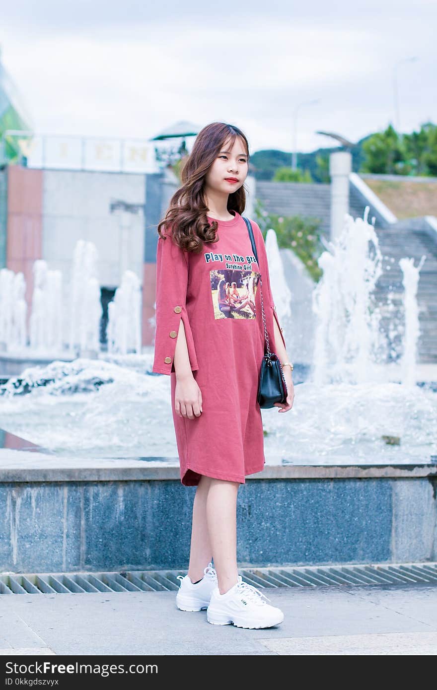 Woman Wearing Pink Dress Standing Near Water Fountain