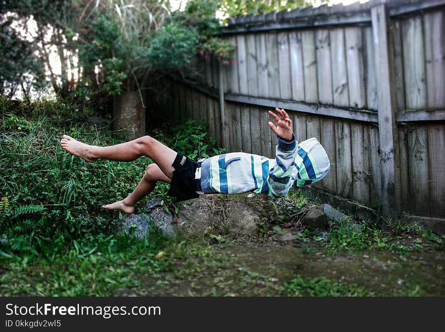 Floating Photography of Man in White and Blue Striped Top