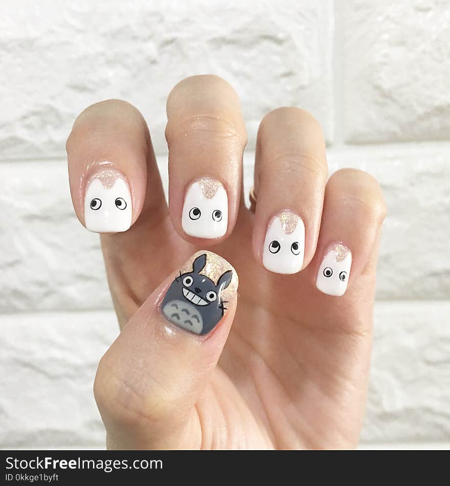 Person&#x27;s Left Hand Showing White Nail Polish