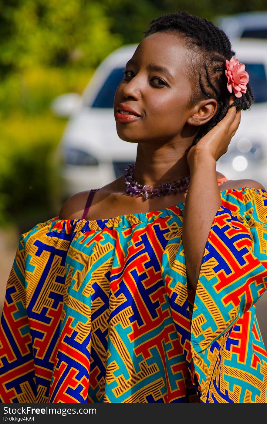 Woman Wearing Multicolored Strapless Top