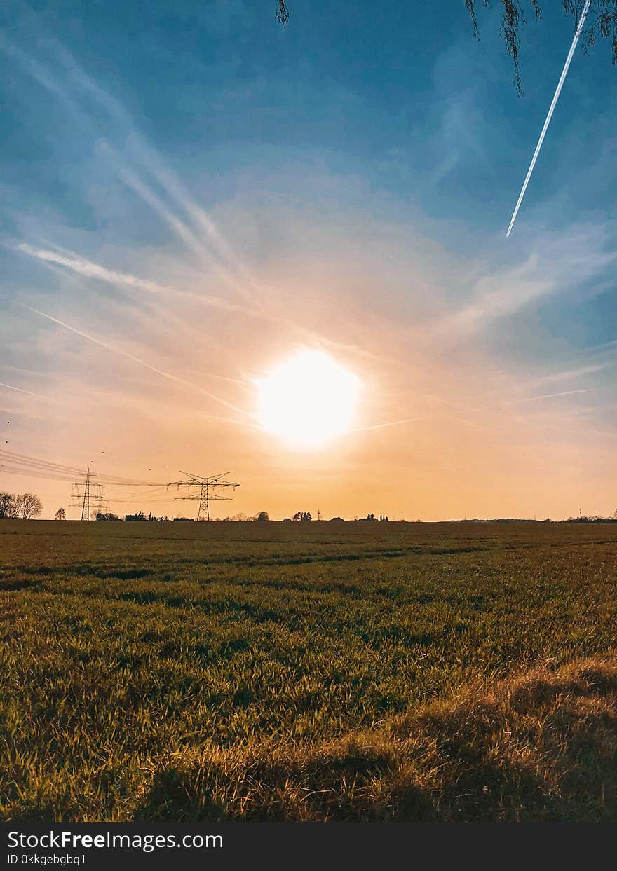 Green Grass Field during Sunset