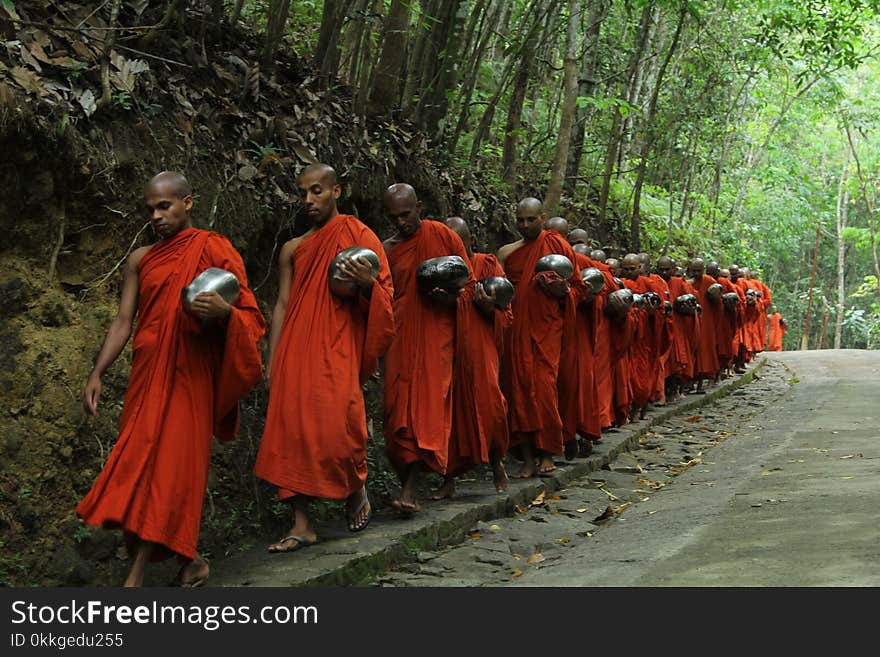 Monks Fall Inline on Sidewalk