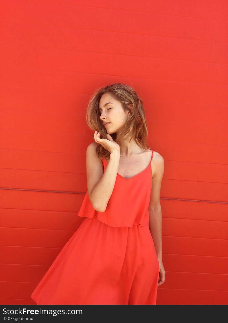 Woman Wearing Orange Spaghetti-strap Dress