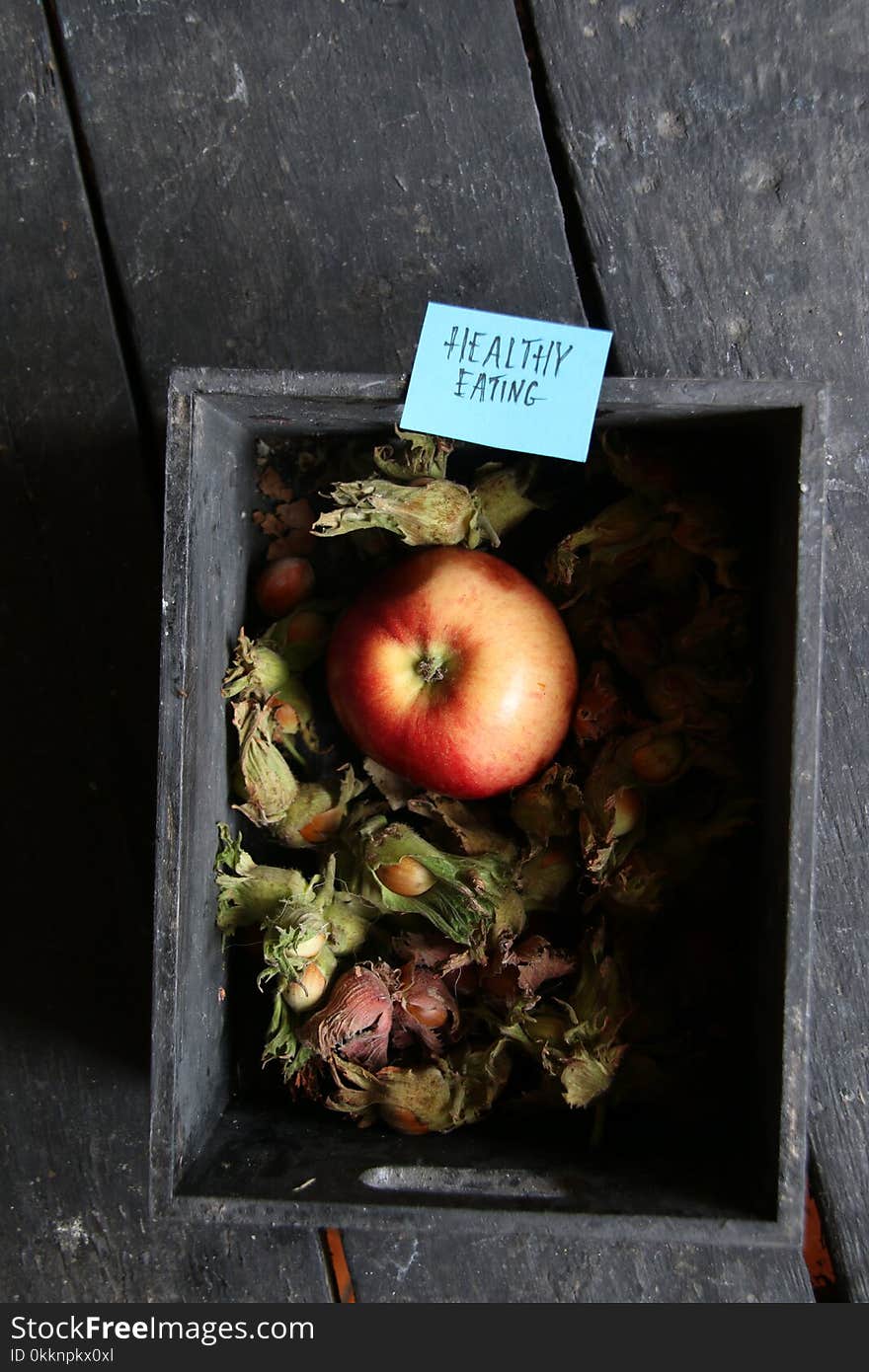 Apple on wooden table and tag healthy eating. Apple on wooden table and tag healthy eating