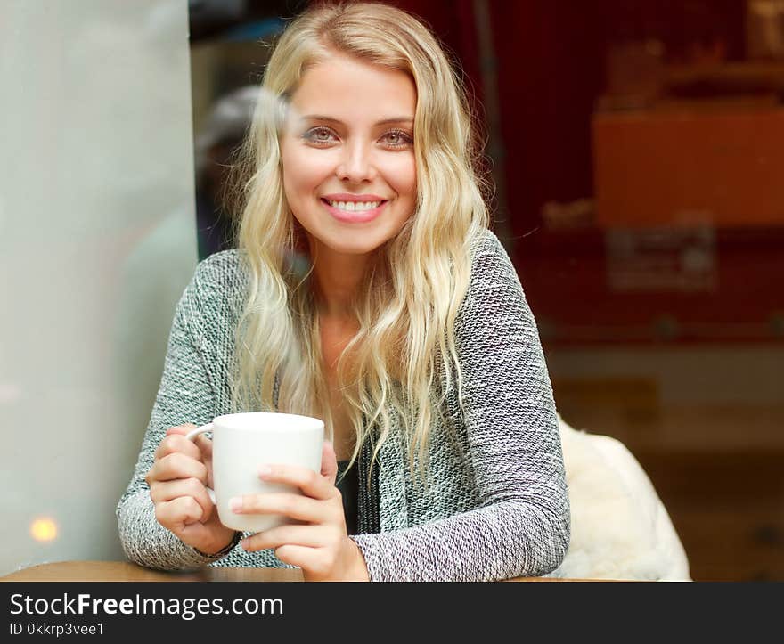 Relaxed Blond Having Coffee.