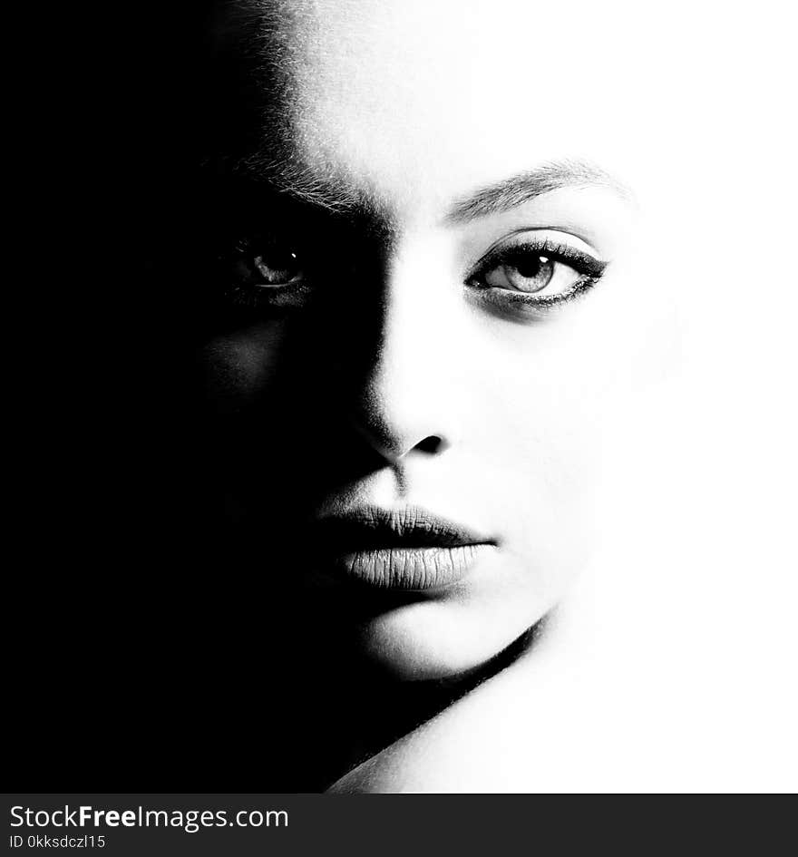 High contrast black and white portrait of a beautiful girl. Femininity and beauty, free space for your text.