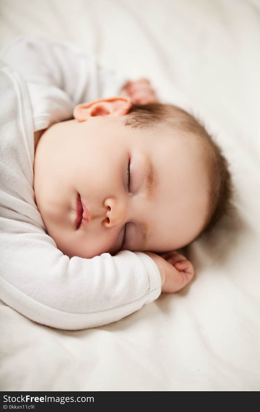 Sleeping newborn baby at home, bedtime