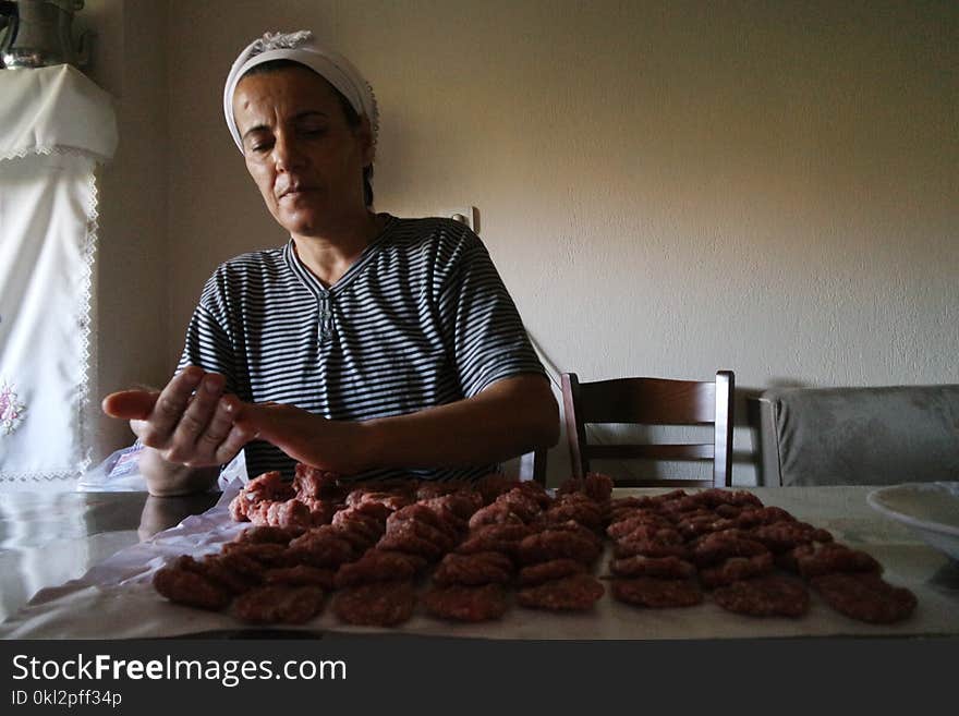 Woman Wearing Black and White Striped Top Preparing Food