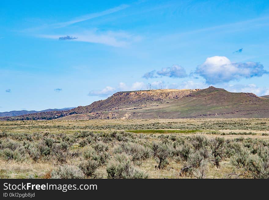 Photography of Grass Across Hill