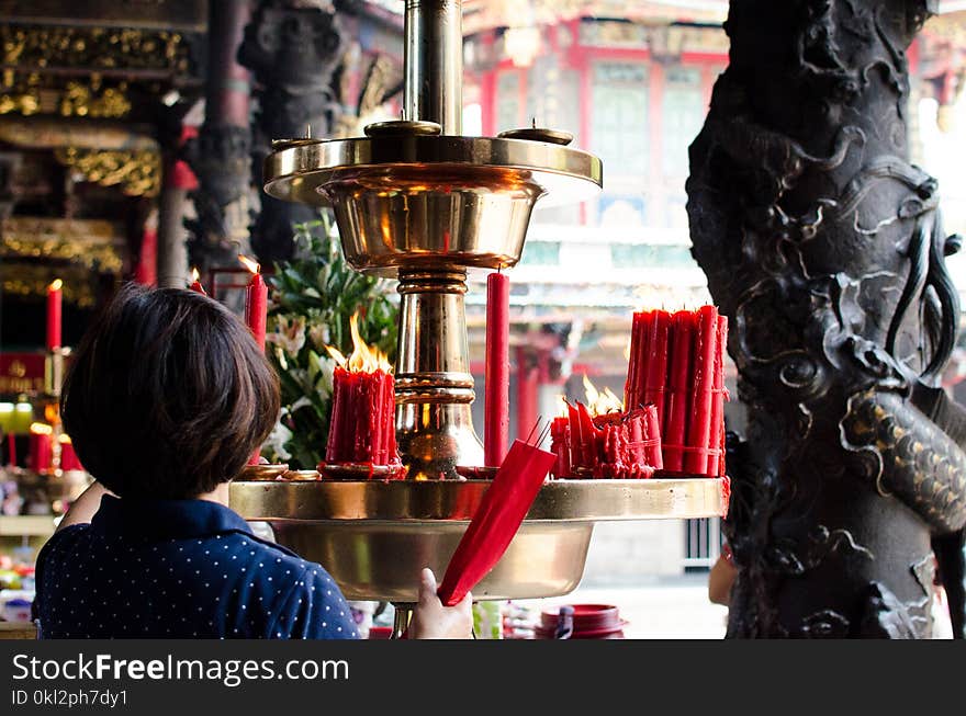 Woman Holding Incense Sticks