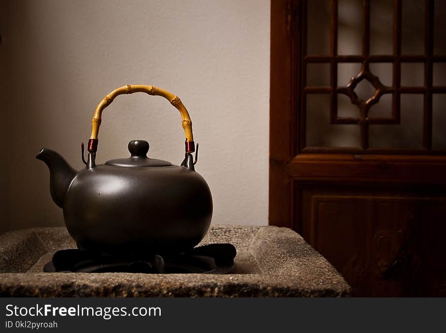 Unused Teapot on Side Table