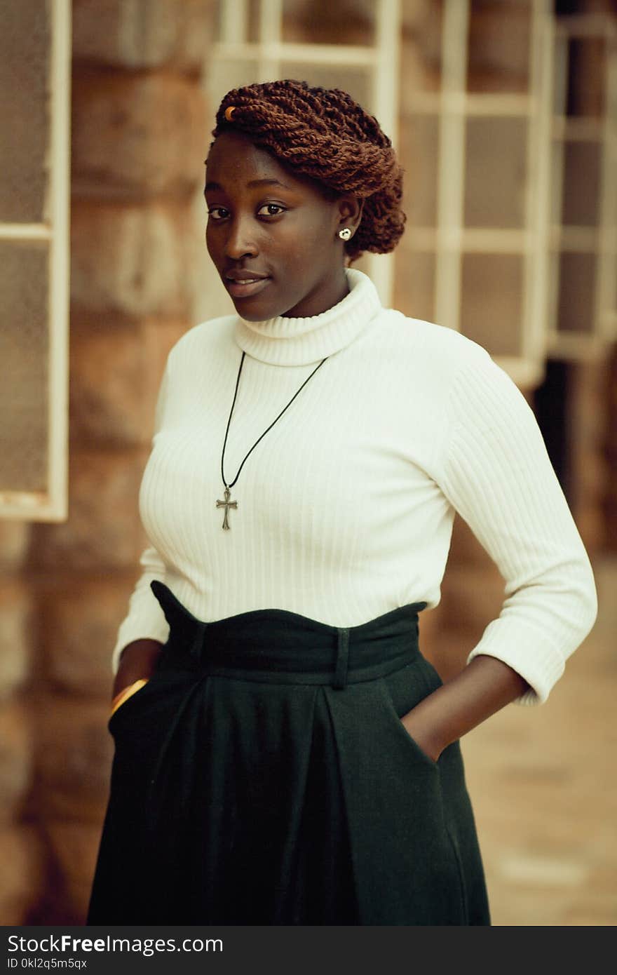 Woman Wearing White Knit Sweater and Black Skirt