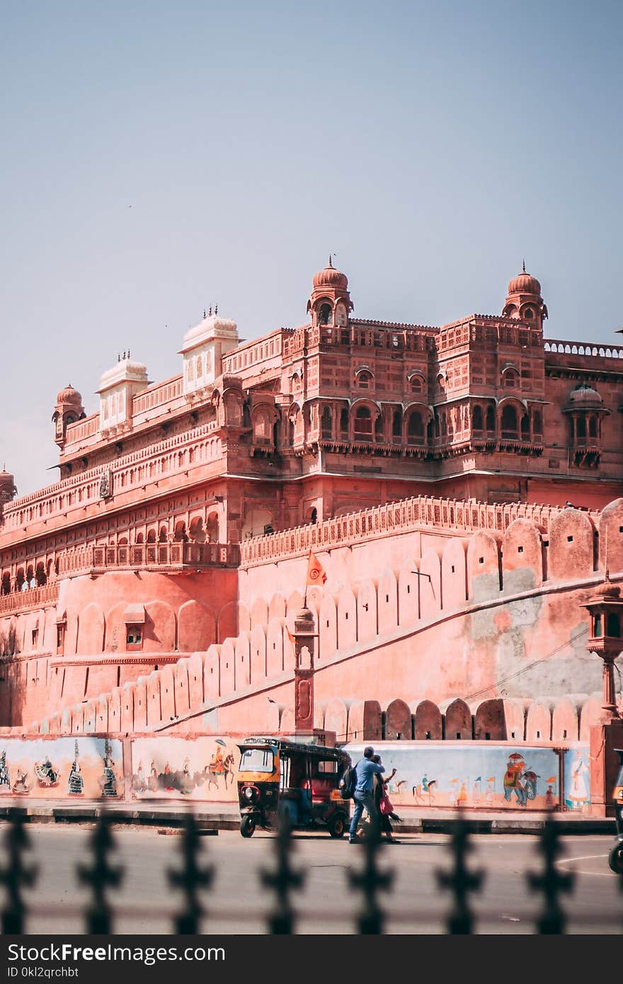 Auto Rickshaw Parked Beside Brown Structure