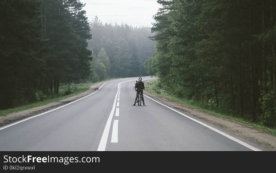 Man With Black Bicycle