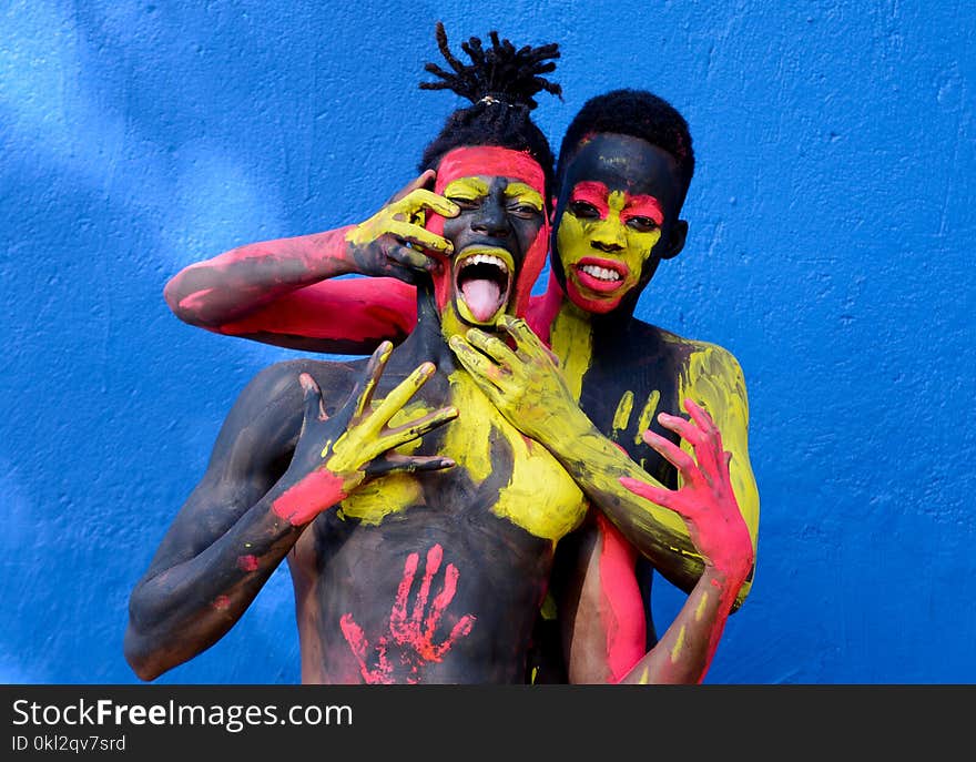 Man Beside a Woman in Body Paint