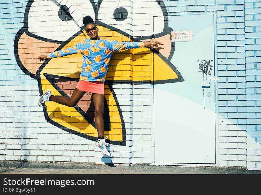 Girl in Blue Sweatshirt and Pink Skit in Jumpshot Photo