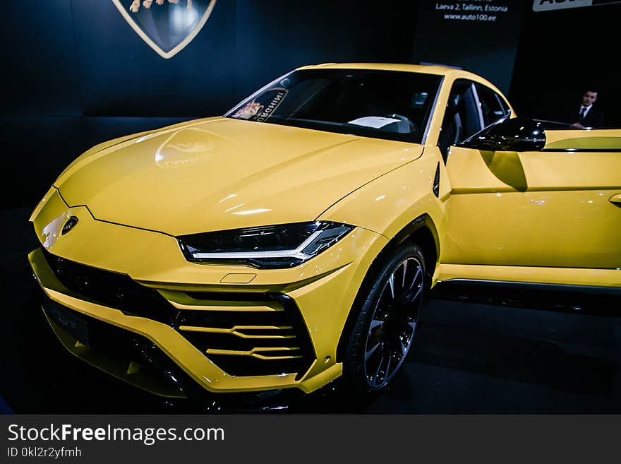 Yellow Luxury Car Near Man