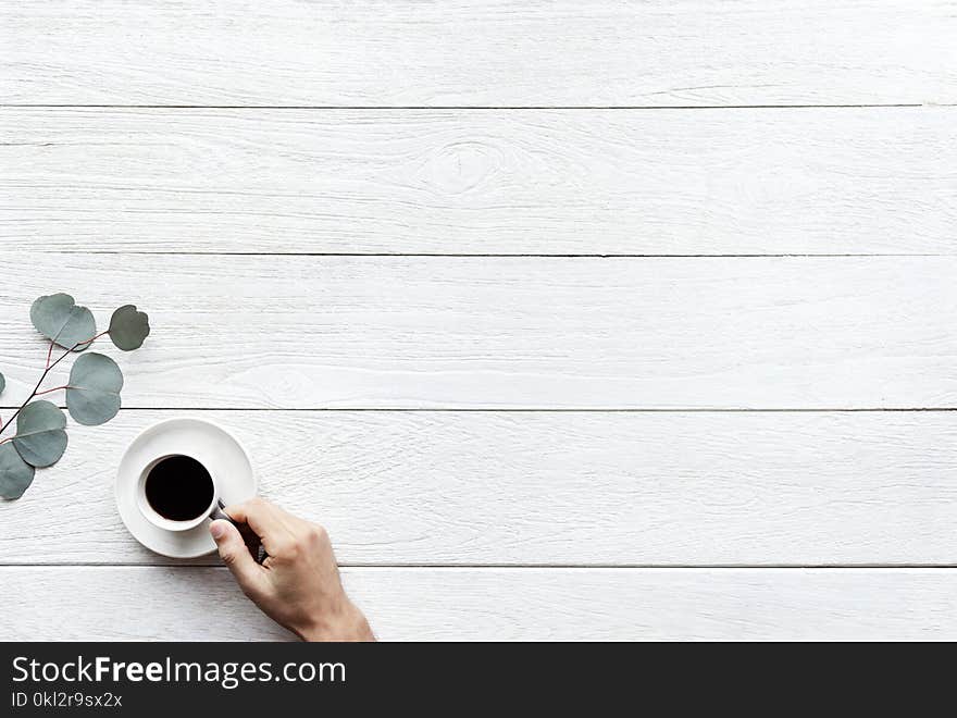 Person Holding White Ceramic Teacup With Black Coffee