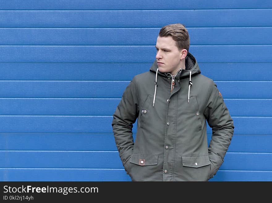 Man Wearing Black Button-up Windbreaker