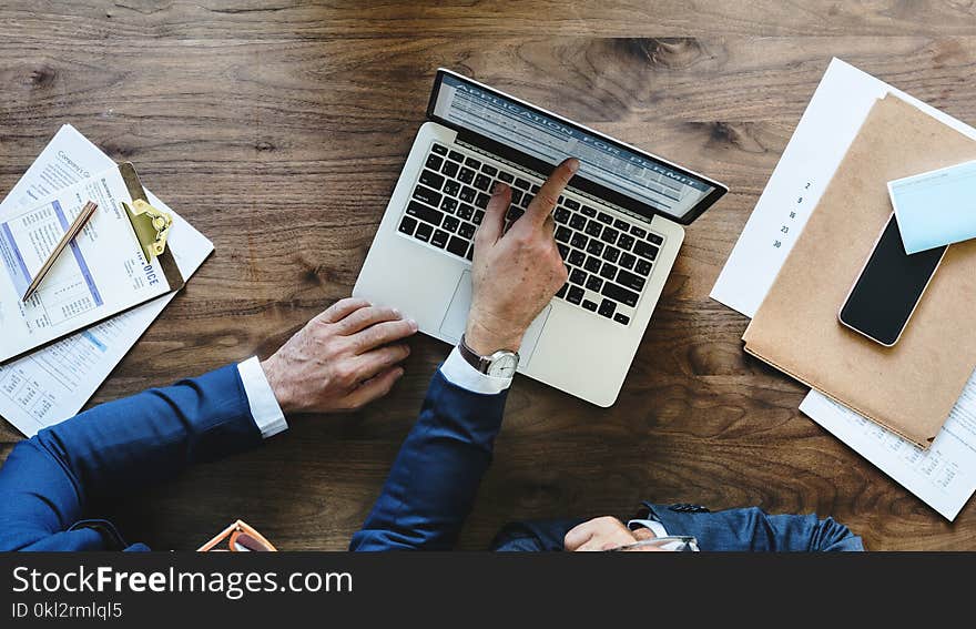 Person Touching Macbook Pro