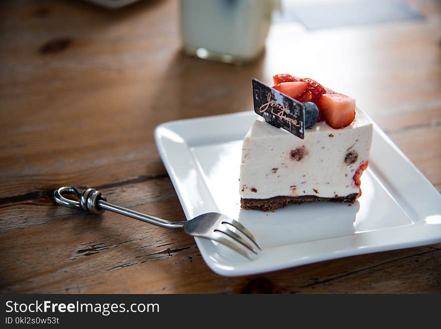 Sliced of Cake on White Ceramic Plate