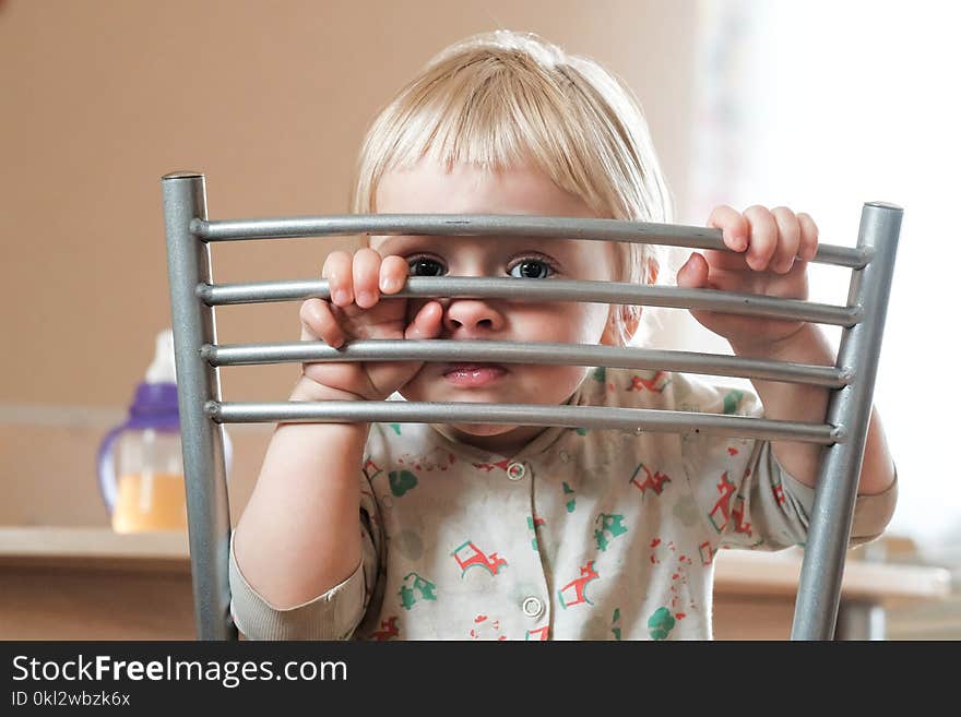 Photo of a cute blond baby with blue eyes. Photo of a cute blond baby with blue eyes