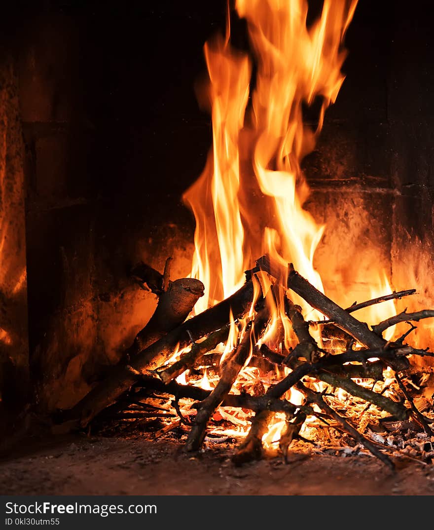 Burning and glowing pieces of wood in fireplace. Burning and glowing pieces of wood in fireplace