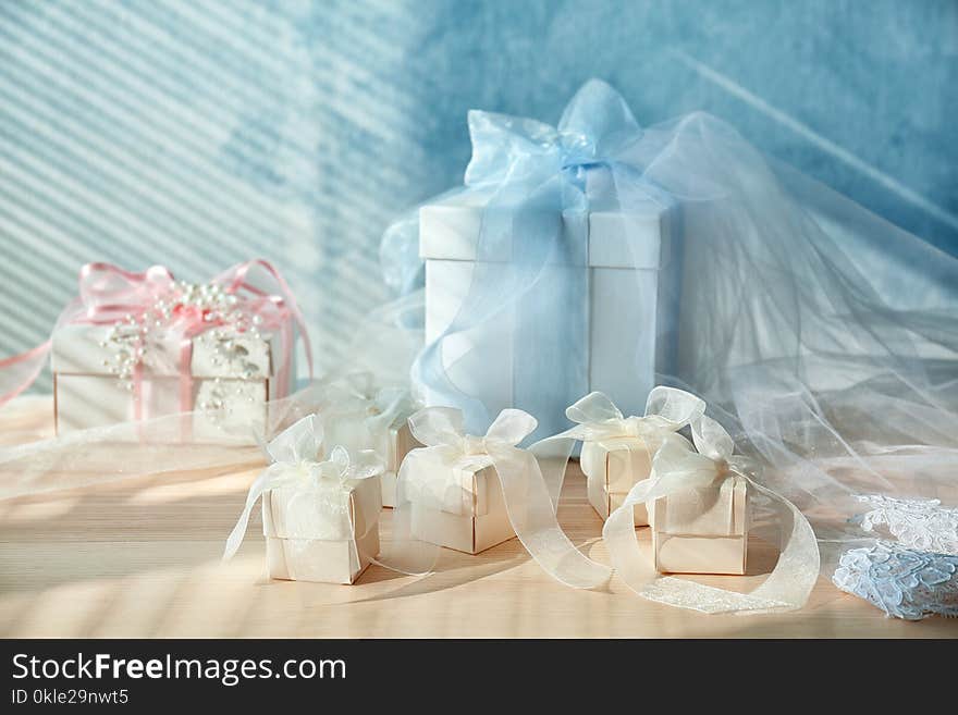 Composition of gift boxes with bows on light background