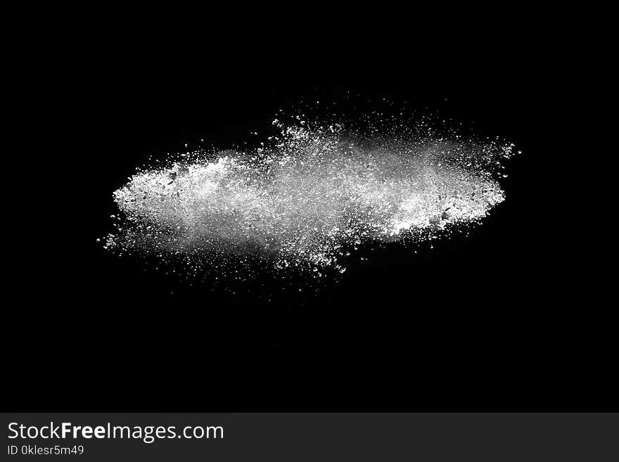 Explosion of white dust on black background. Explosion of white dust on black background.