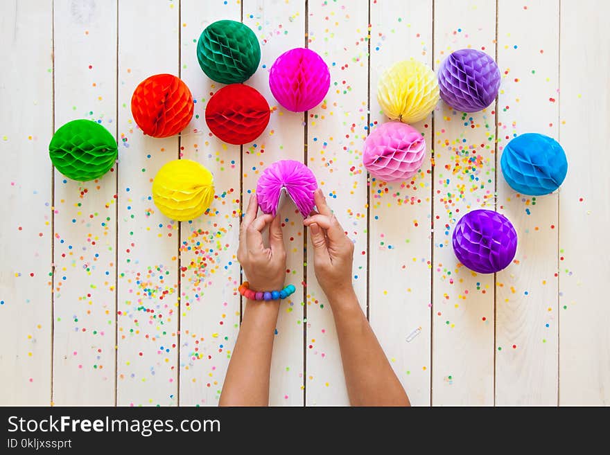 Paper Balls And Confetti In Bright Different Colors. White Wood