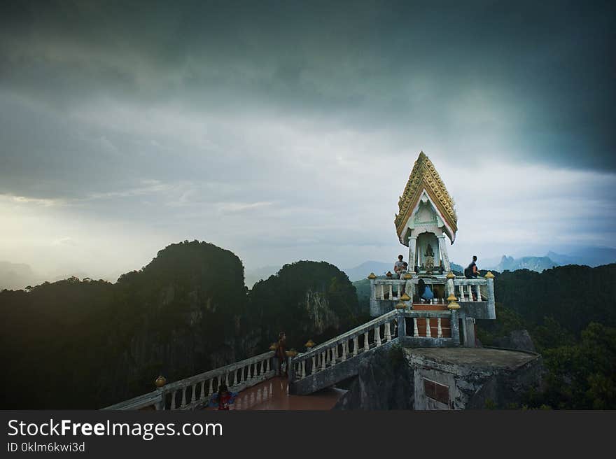 Aerial View Photography of Mountains Under Cloudy Sky