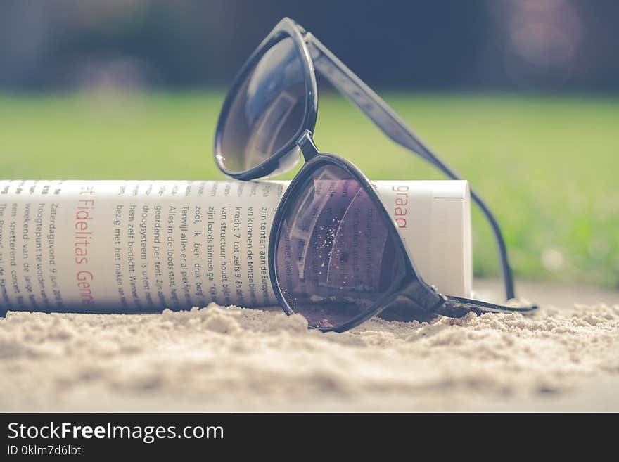 Black Sunglasses on Book