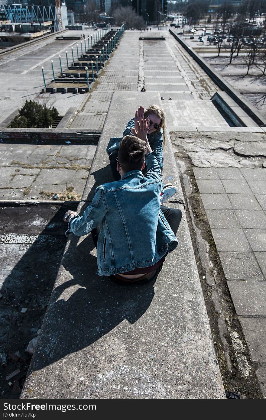 Sitting Man Wearing Blue Chambray Jacket