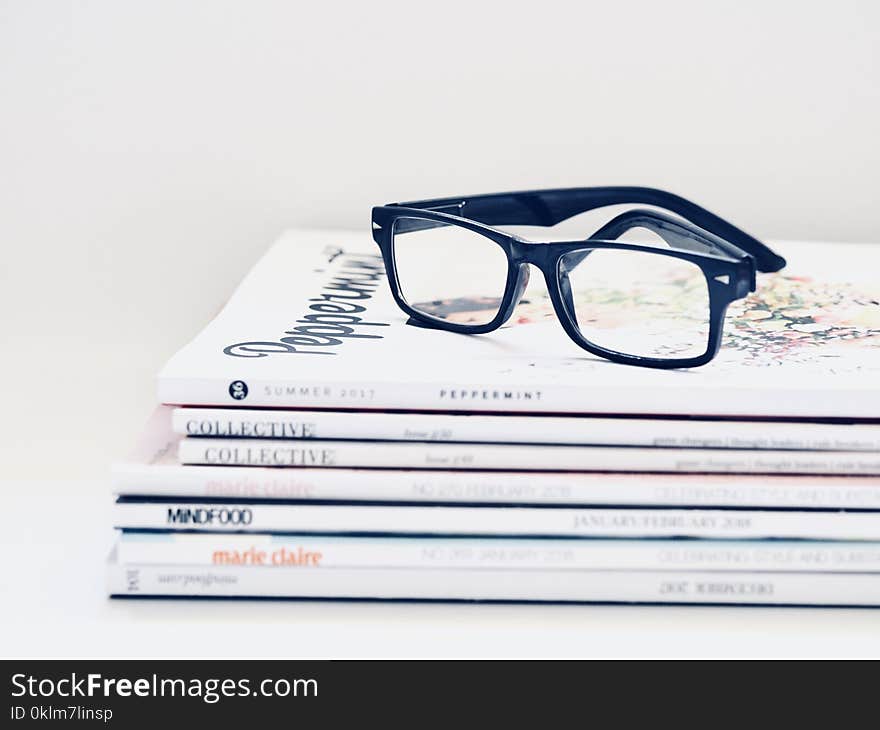 Black Framed Eyeglasses on Seven Collective Books