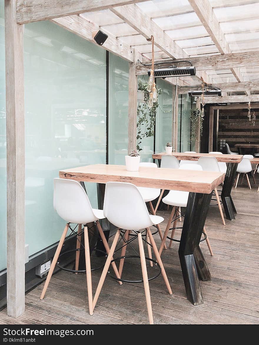 Two Table With Eight Chairs Inside Room