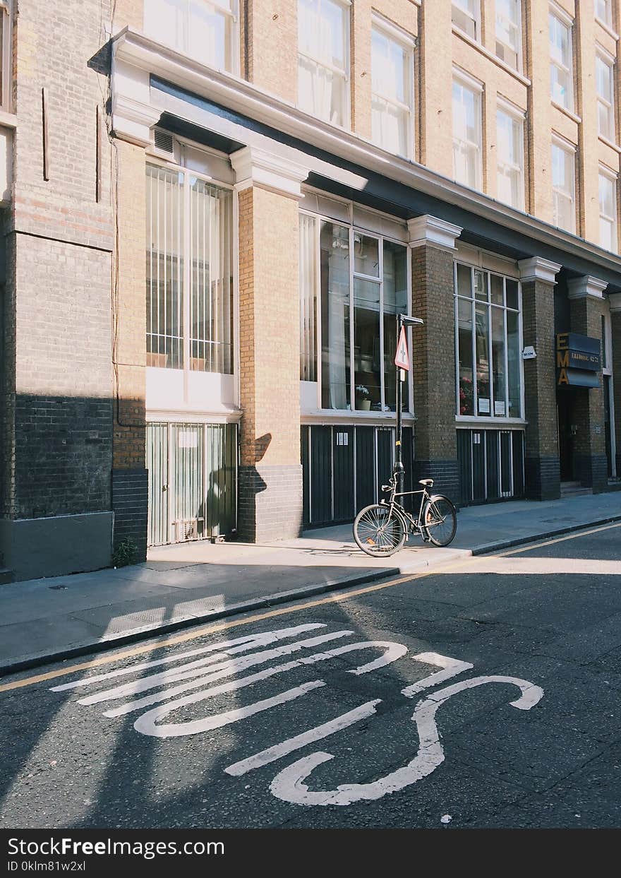 Black City Bicycle in Front of Building